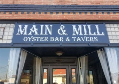 Main and Mill Oyster Bar and Tavern restaurant entrance sign